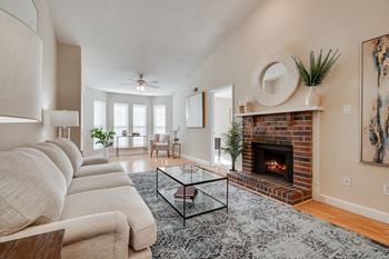 Living Room With Fireplace & Bay Windows